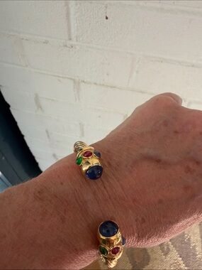 Gold cuff costume bracelet with cabuchon jewels